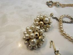 Pearl colored necklaces with earrings