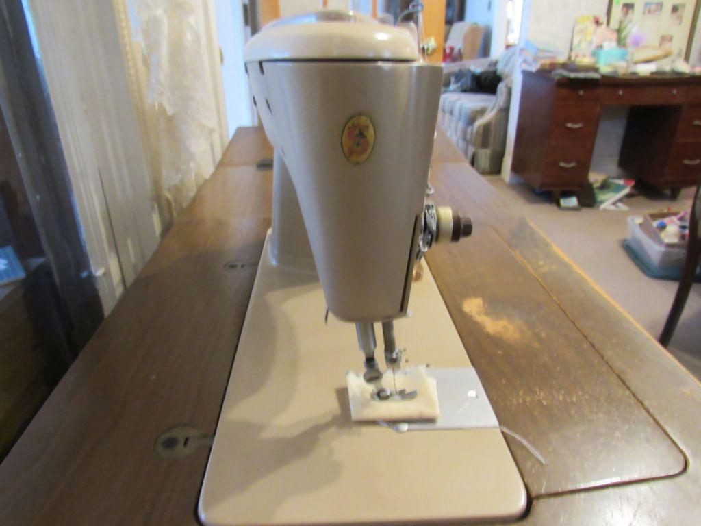 Singer sewing machine with cabinet