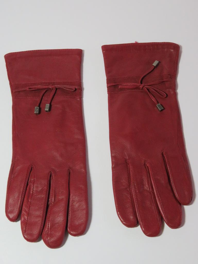 Two designer Suede purses and a pair of leather gloves