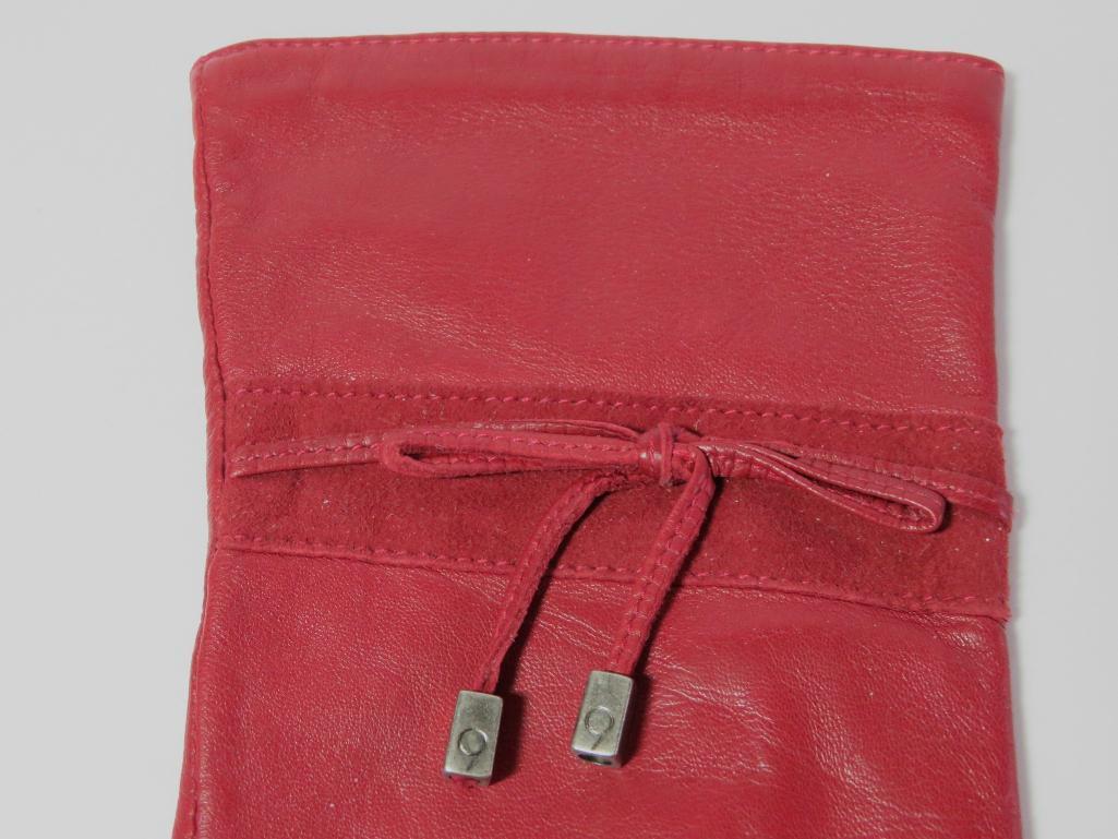 Two designer Suede purses and a pair of leather gloves