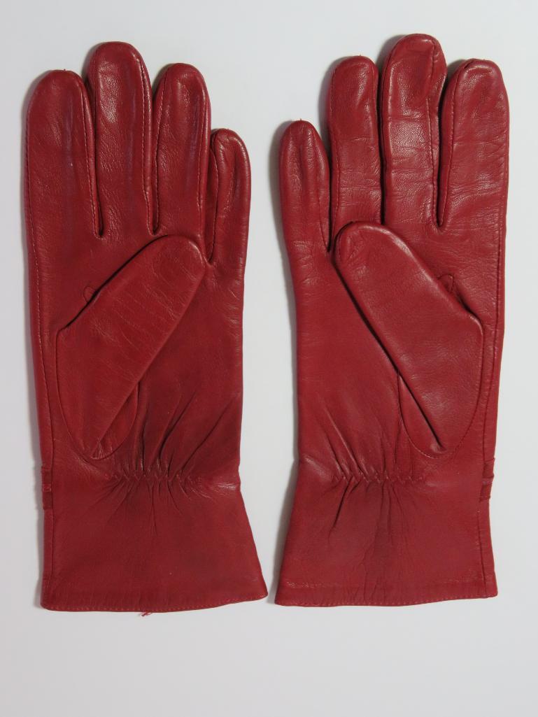 Two designer Suede purses and a pair of leather gloves