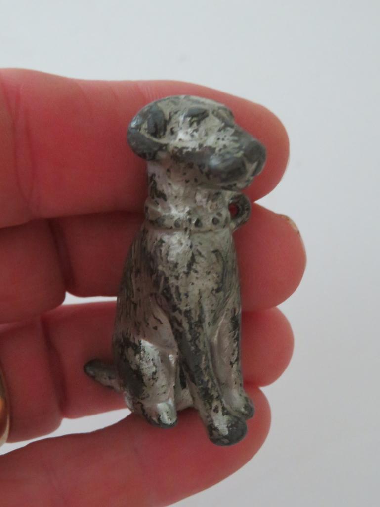 Two miniature metal dog paperweights