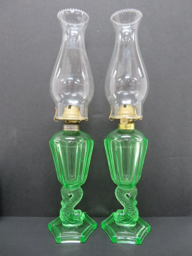 Pair of green vaseline glass dolphin base oil lamps, 10"