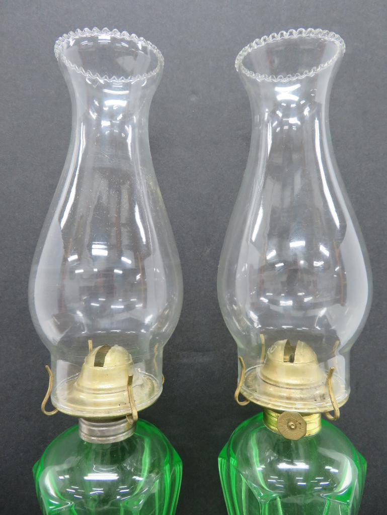 Pair of green vaseline glass dolphin base oil lamps, 10"