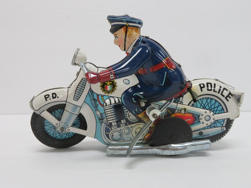 Japanese tin windup Police Motorcycle with acrobatic action, with box, working