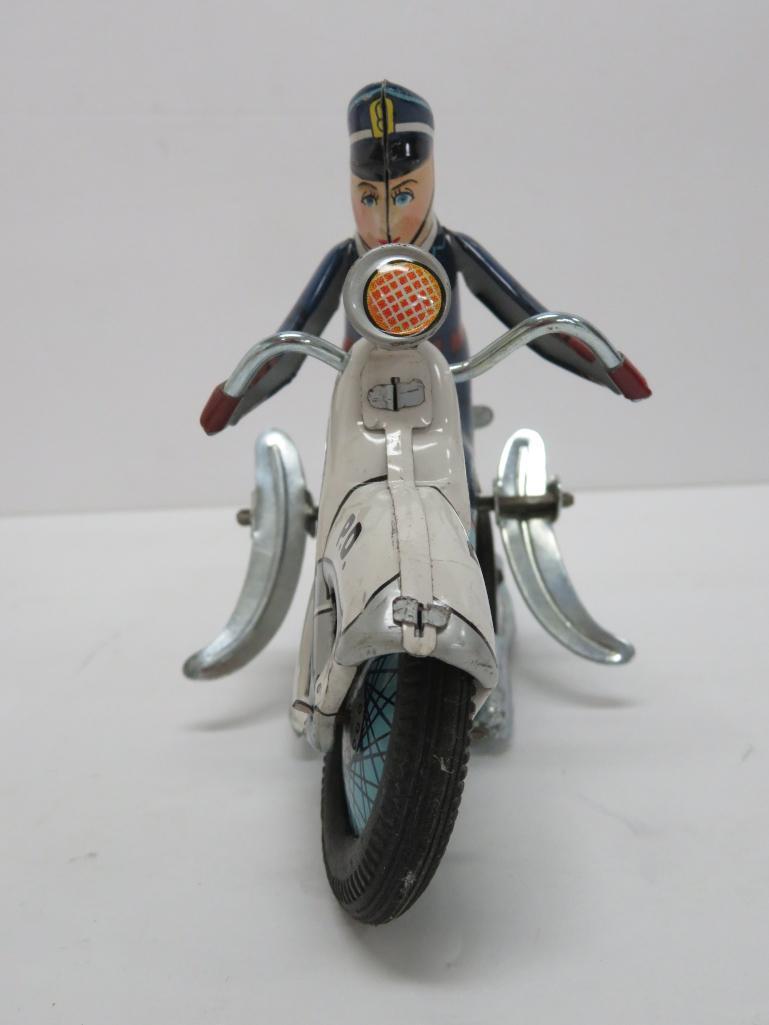 Japanese tin windup Police Motorcycle with acrobatic action, with box, working