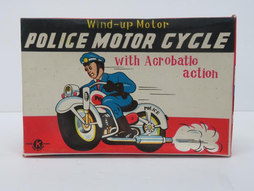 Japanese tin windup Police Motorcycle with acrobatic action, with box, working