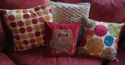 Four decorative accent pillows, 13" to 17"