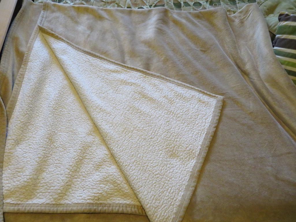 Bedspread and four accent pillow and Sherpa and suede cloth blanket