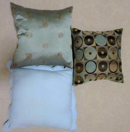 Three accent pillows, 16" and 20", blue and brown