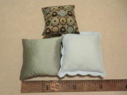 Three accent pillows, 16" and 20", blue and brown