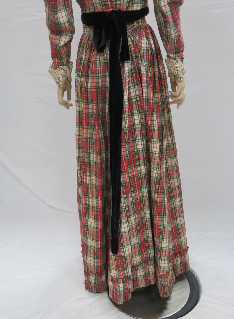 Two piece plaid outfit, skirt and top with lace and velvet embellishments, and hat
