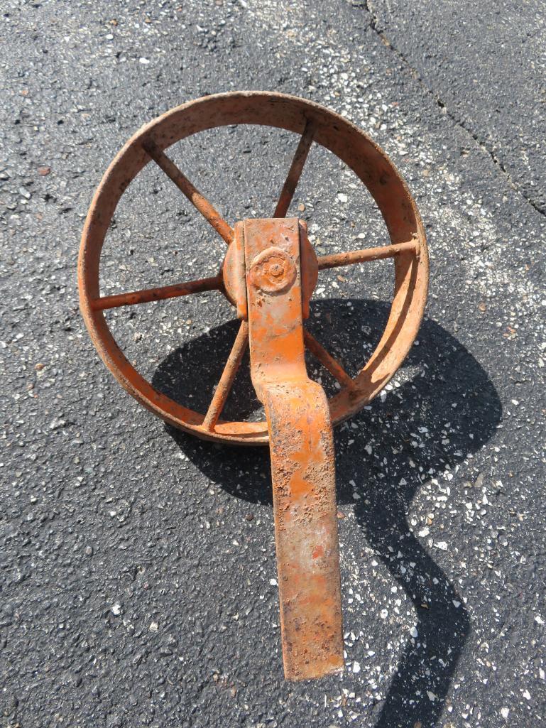 Two implement or wagon tires 6.5 x 16 and 12" Cast iron wheel