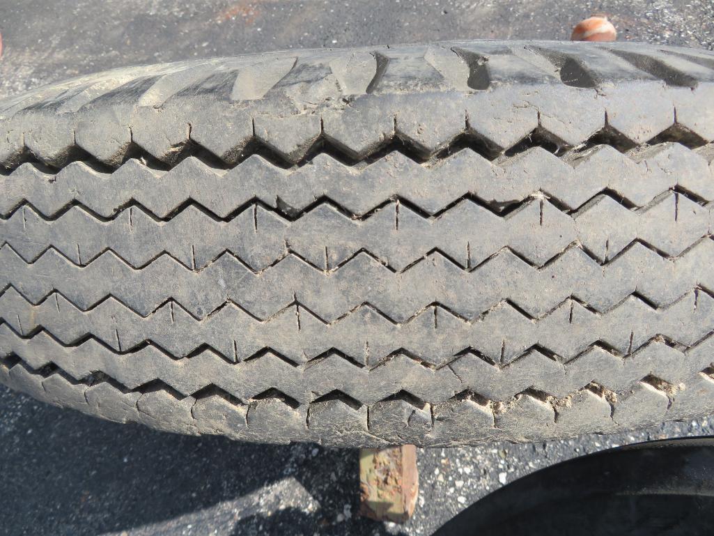 Two implement or wagon tires 6.5 x 16 and 12" Cast iron wheel