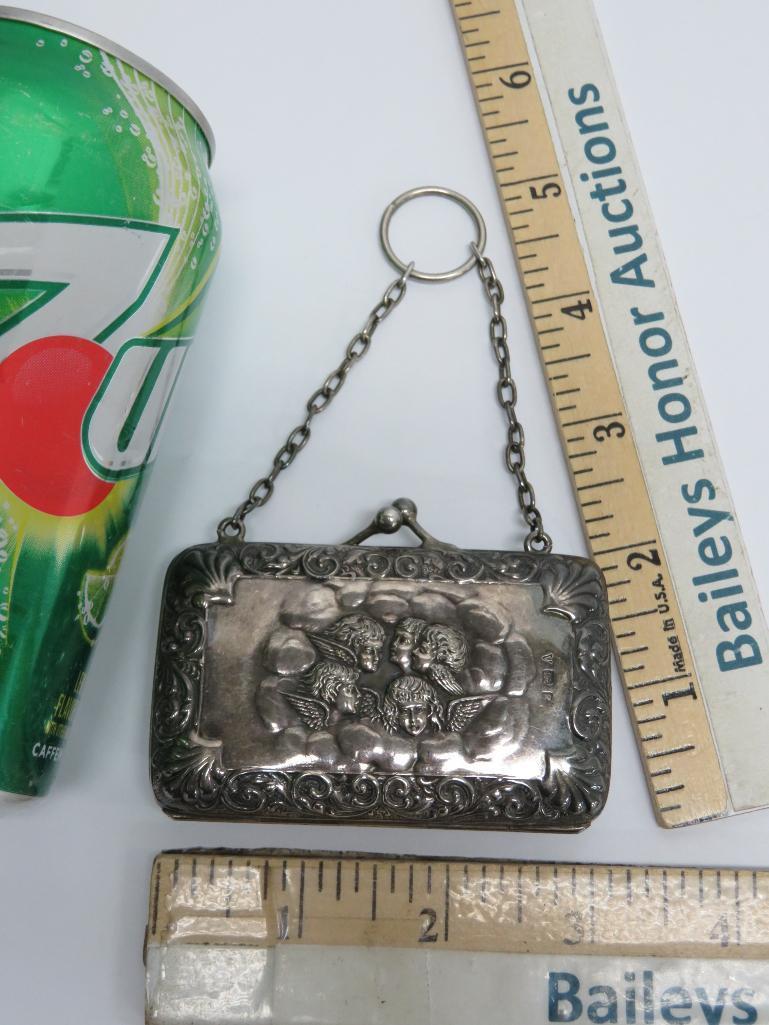Silver hallmarked coin purse, cherubs, 2" x 3"