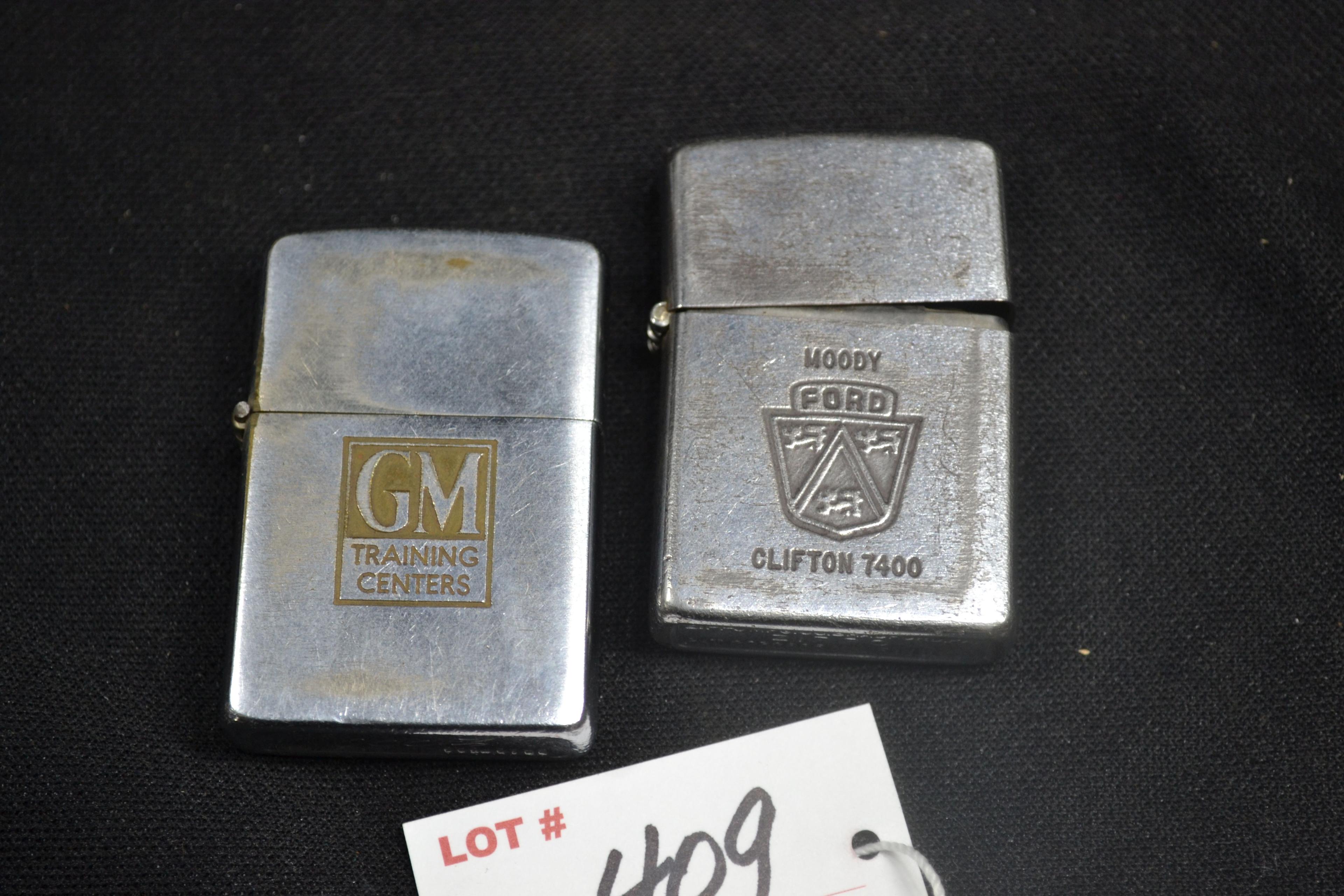 Pair of Zippo Flip-Up Lighters including GM and Ford