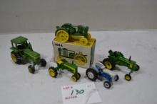 Group of Ertl John Deere 1/64 Scale Tractors including Row-Crop, Waterloo Boy, 430, 520, and One For