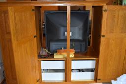 Oak Entertainment Center includes TV only(back opens up with 3 doors)