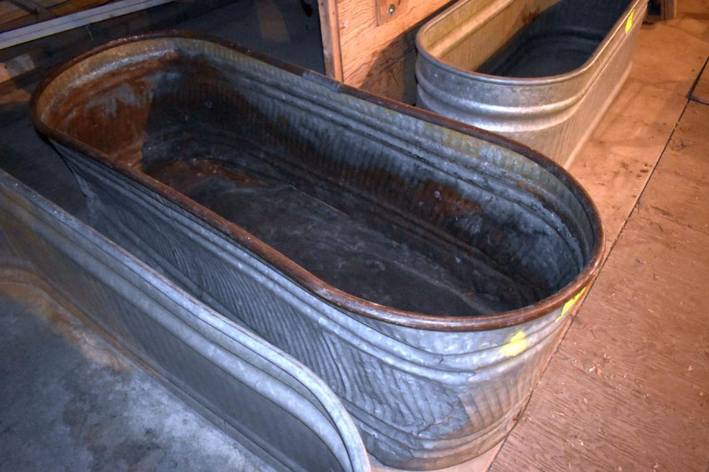 Galvanized water tank has hole, located building 6