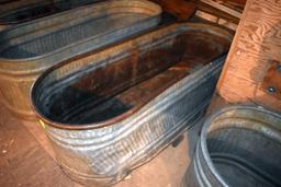 Galvanized water tank has hole, located building 6
