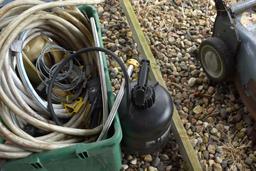Garden hose, sprayer, watering can, cooler and whirly bird