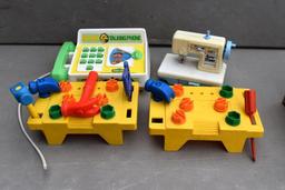 Children's sewing machine, Little Tikes tool sets, and talking phone