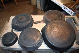 5 Cast iron pans, including Griswold and Wagner