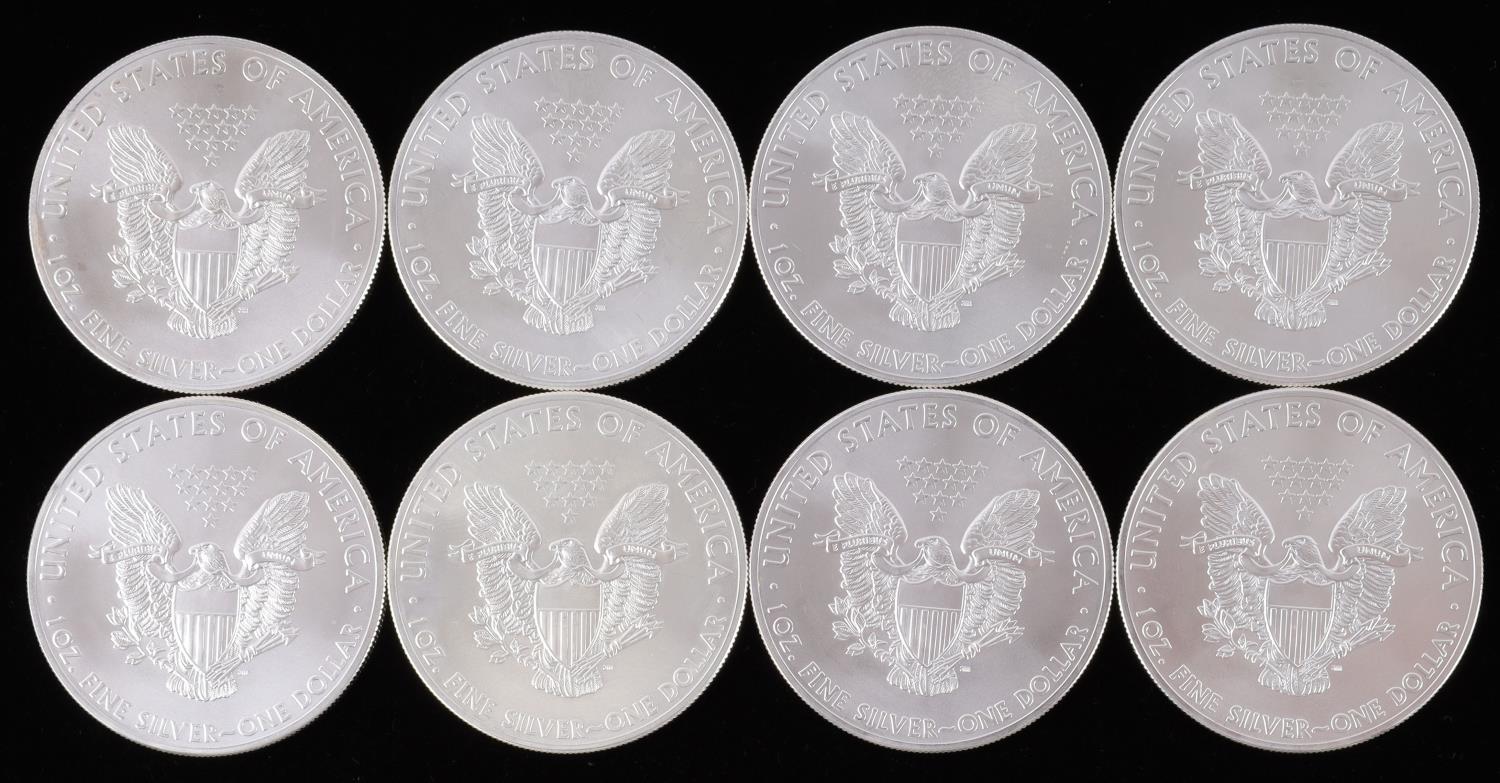 LOT OF 8 1 OZ AMERICAN SILVER EAGLE $1 COINS