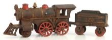 ANTIQUE CAST IRON TOY TRAIN WITH TENDER.