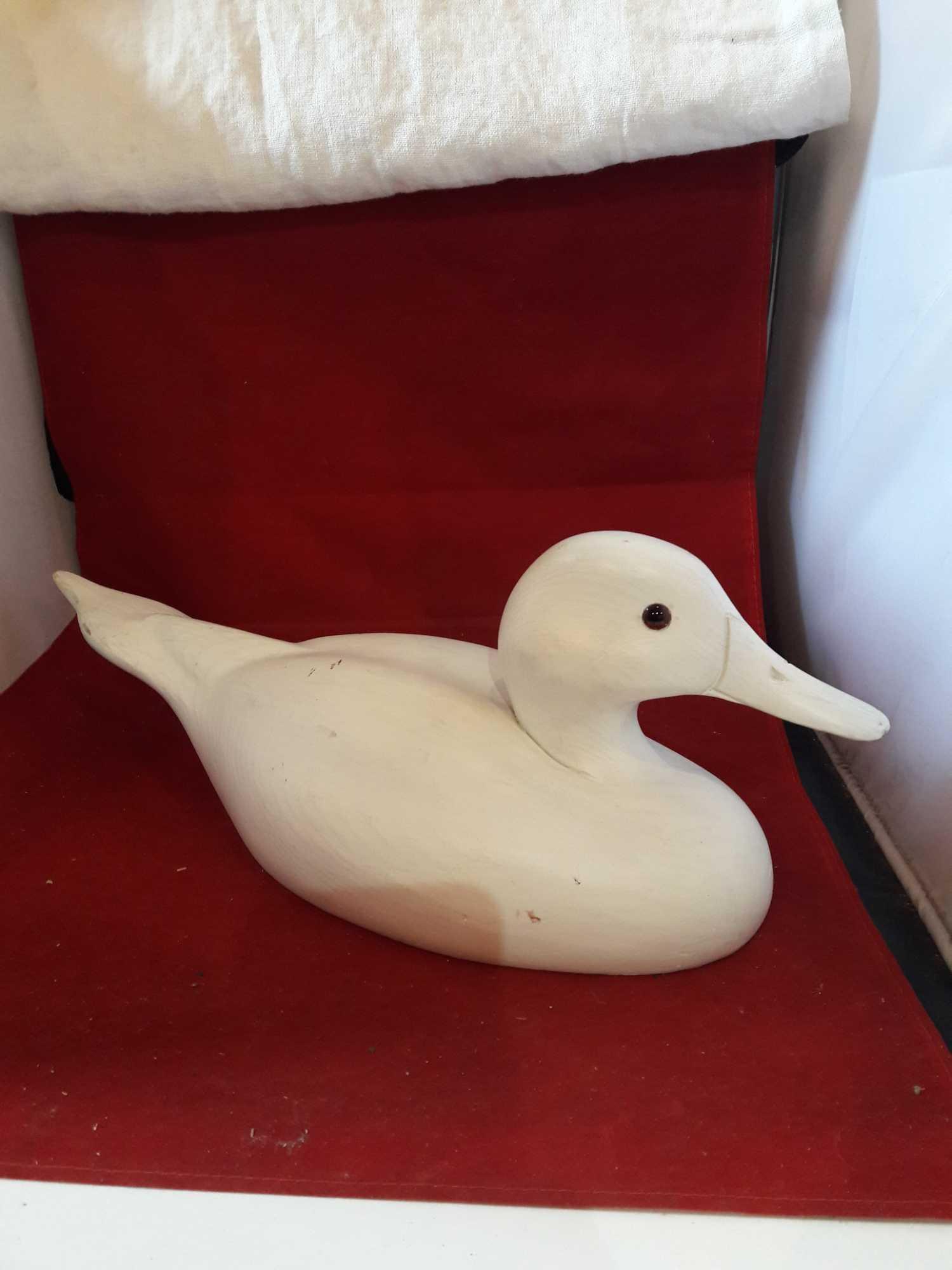 Primed wood duck decoy