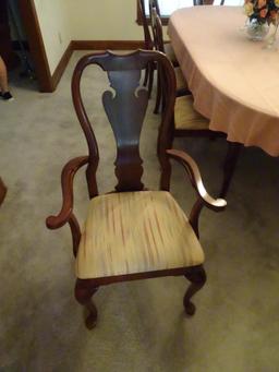 Oval dining room table w/ 8 chairs, 44"W x 100" L x 29"H-(table top needs to be refinished).