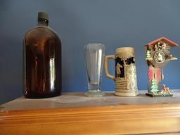 Items on shelves on top of bookcase. Walkie Talkies, Ansel Adams "Oak Tree" reproduction, bookends,