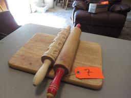 ROLLING PINS ON CUTTING BOARD