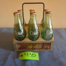 OLD COKE BOTTLES IN OLD METAL CRATE