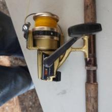 6 FT. SEARS ROEBUCK FISHING ROD AND REEL