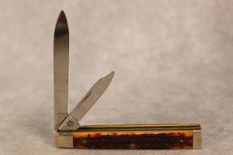 2002 DRK AMBER BONE DR. KNIFE. 6285 SS