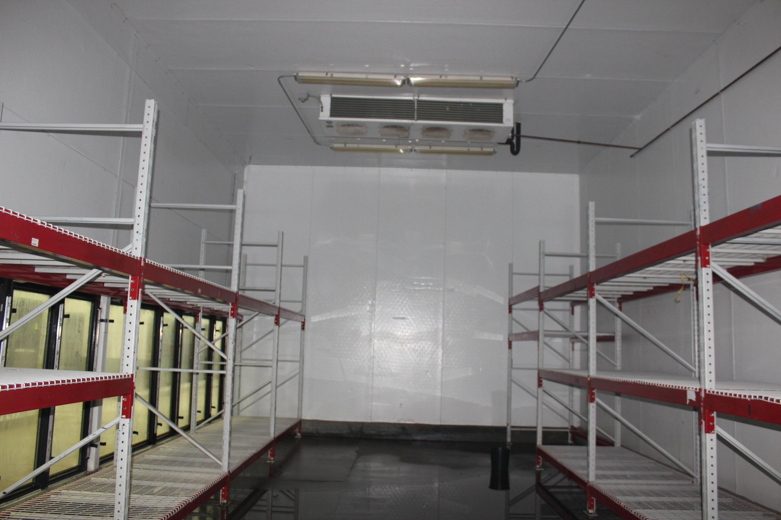 12 Door Freezer. Comes with pallet wide door, 8 sections pallet rack, 2 Bohn 4 fan coils.  36x20x20'