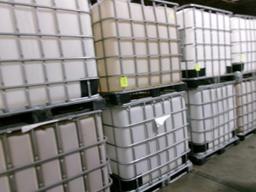 Large plastic liquid containers with dispenser valve in metal frame
