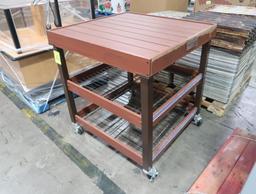 Wooden top table on casters