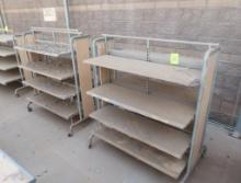 2-sided merchandising shelving units, w/ shelves, on casters