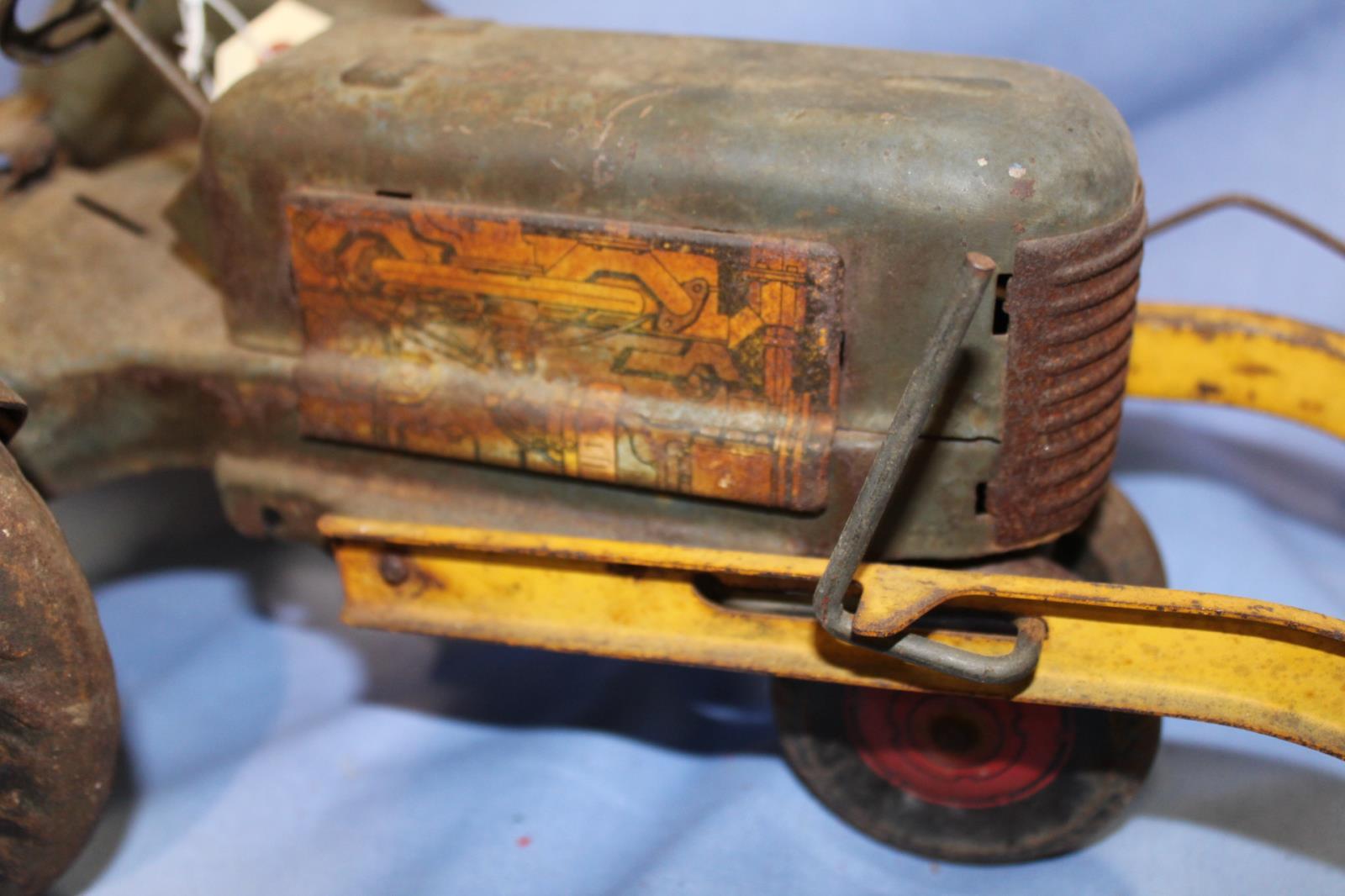 UNKNOWN MAKER STAMPED MEDAL TRACTOR, 16 IN LONG