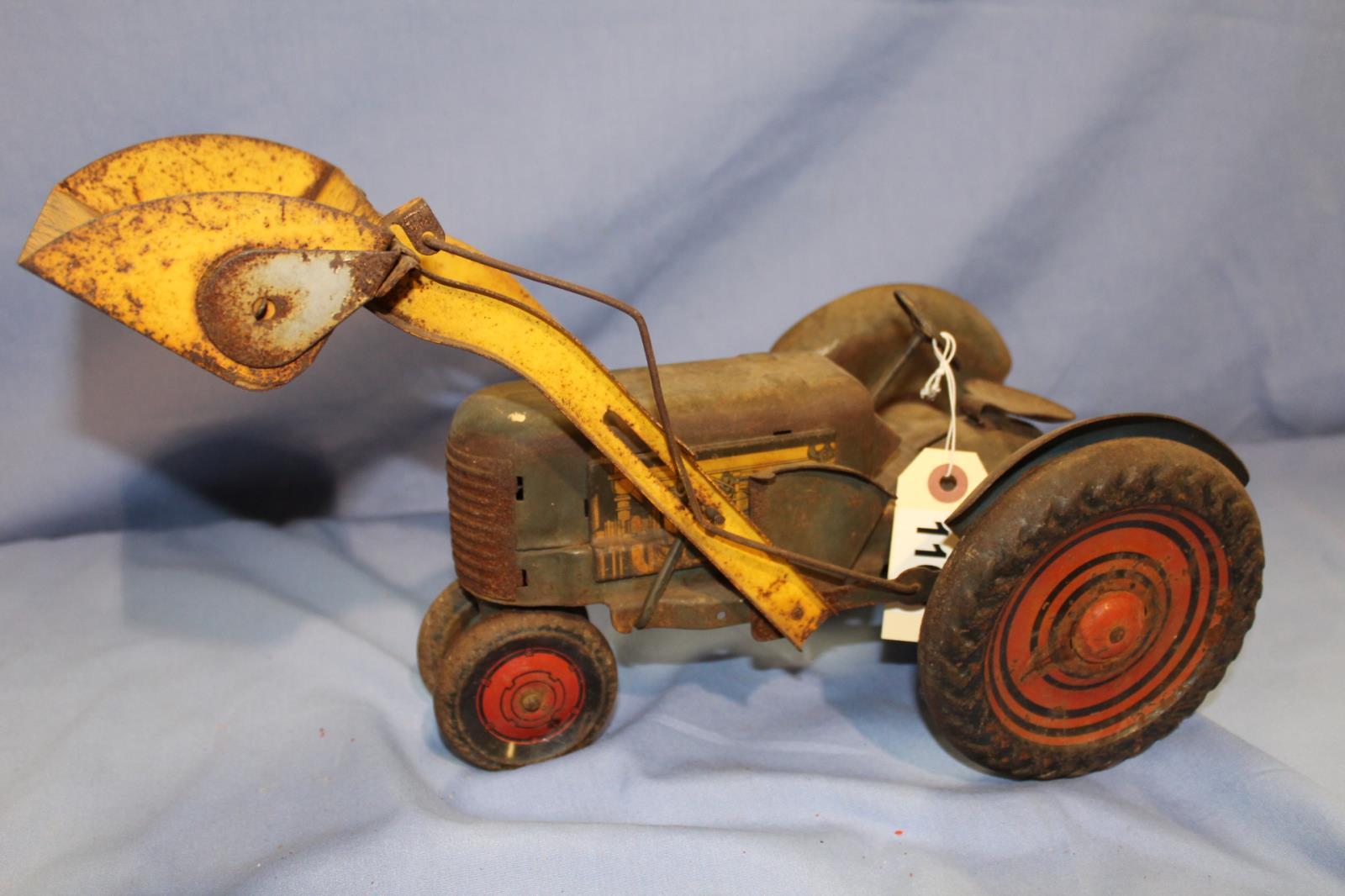 UNKNOWN MAKER STAMPED MEDAL TRACTOR, 16 IN LONG