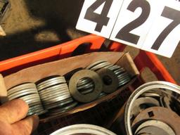 assorted large flat washers and cap screws