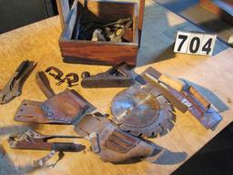 Homemade wood tool caddy with mixed tools ;including Stanley plane, leather tool holsters, sawblades