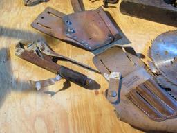 Homemade wood tool caddy with mixed tools ;including Stanley plane, leather tool holsters, sawblades