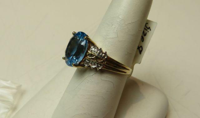 10K -yg- oval Helenite ring, size 7 1/2, weight 4.0, with 12 cubic zirconia