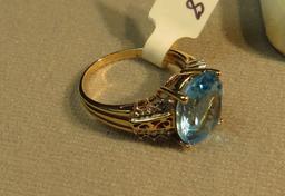 10K -yg- oval Helenite ring, size 7 1/2, weight 4.0, with 12 cubic zirconia
