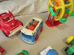 mixed cars and carnival rides with little people - lading machine, Ferris wheel, swing ride, bus, tr