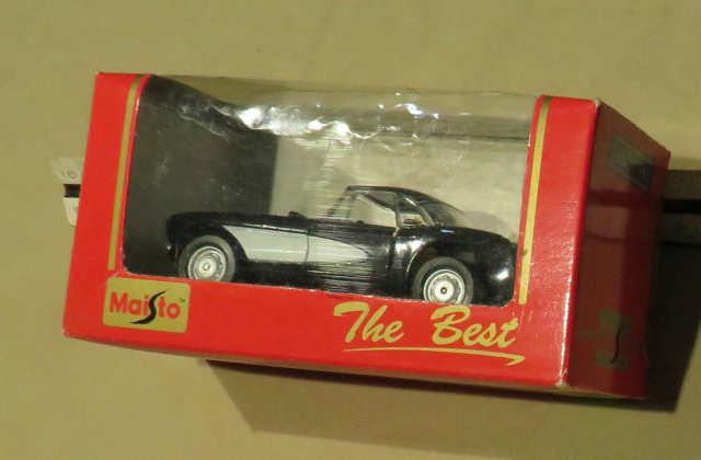 Maisto Trophy 1957 black and white Corvette 1/32 scale die cast metal car in original packaging