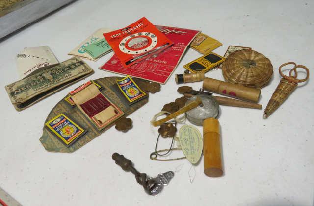 assorted vintage advertising needle cases with needles, and pins